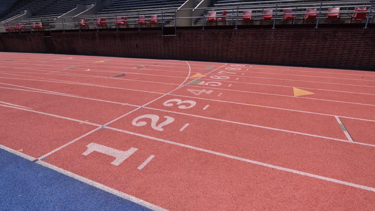 Photo of a track with the stadium seatin behind